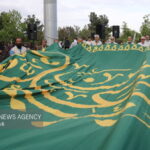 تعویض پرچم رضوی در میدان قائم آمل